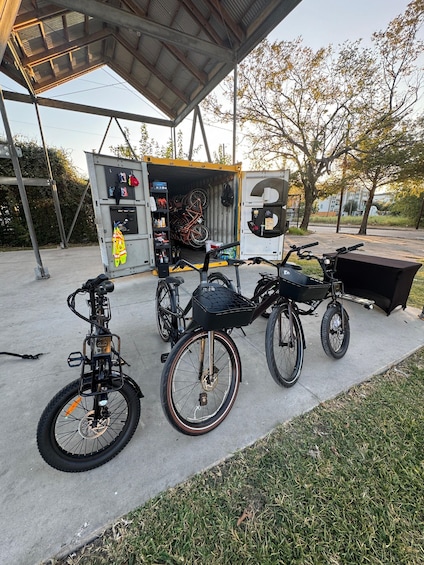 A covered bicycle repair station with tools and spare parts. 3