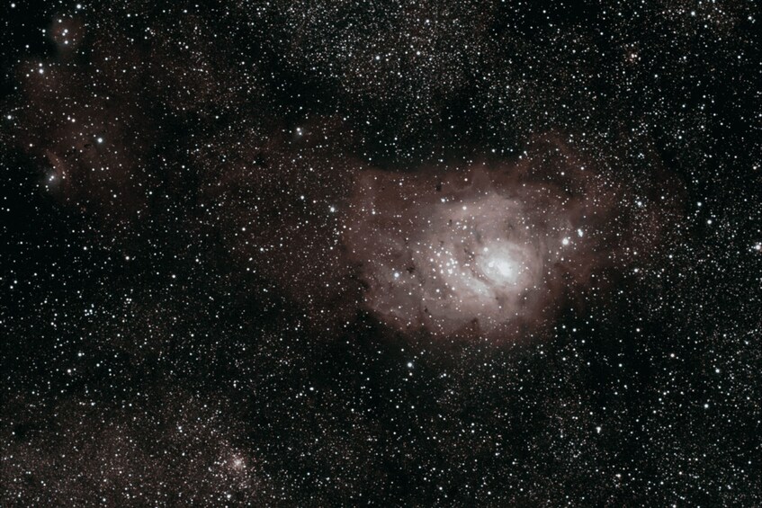 A star-filled night sky with a prominent nebula. 1