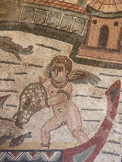 A mosaic with a central figure, geometric patterns, and architectural elements. 1