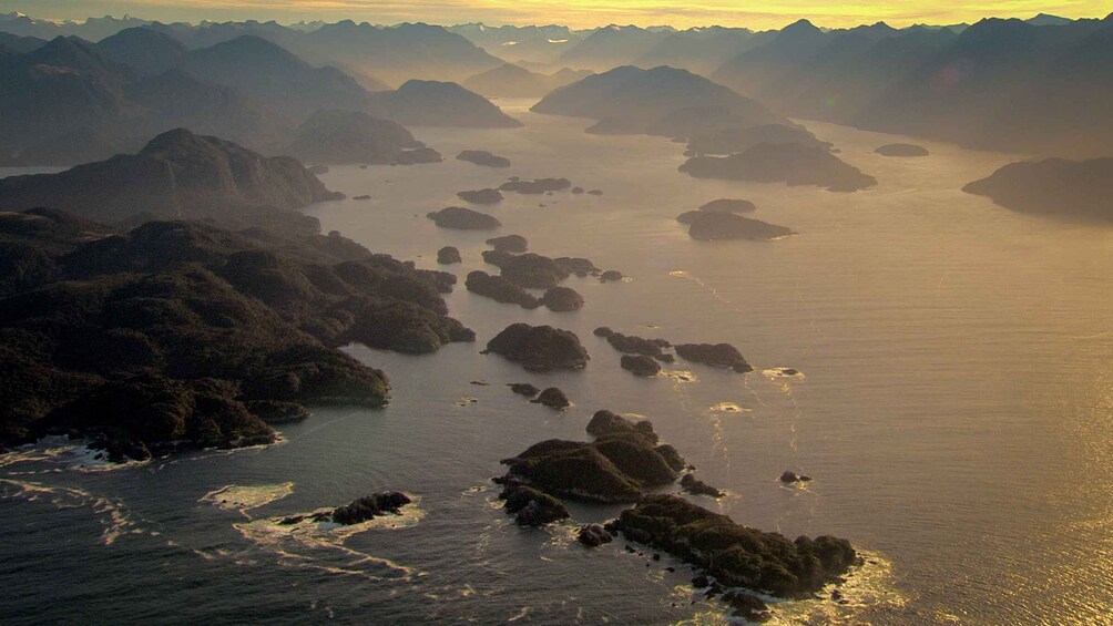 A coastal landscape with numerous islands and rocky outcrops surrounded by water. 5