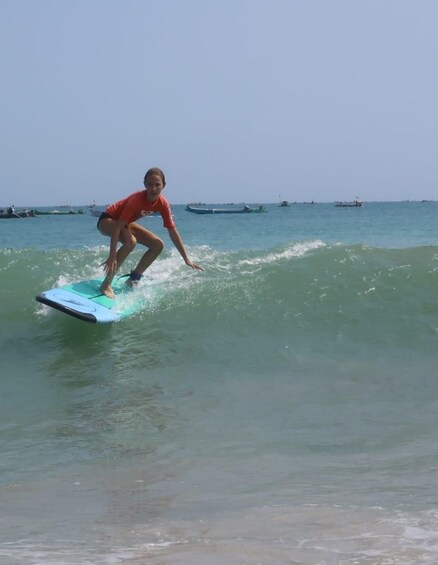 A person surfing on a wave. 5