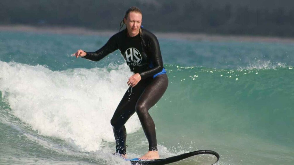 A person surfing on a wave. 1