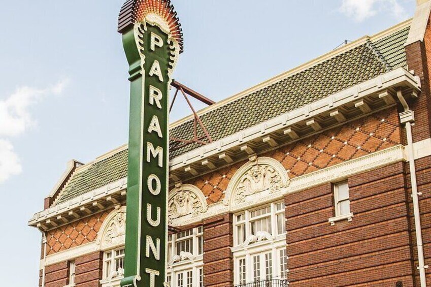 A building with a green sign that reads 'PARAMOUNT.' 3