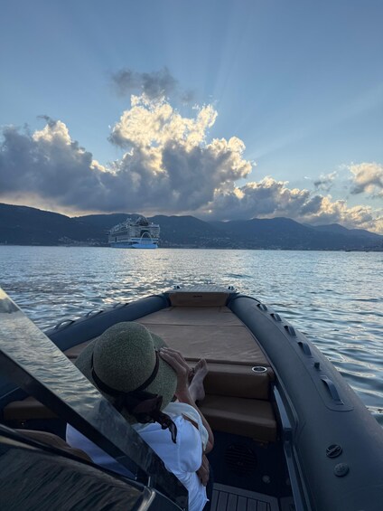 A boat on water with mountains in the background. 4