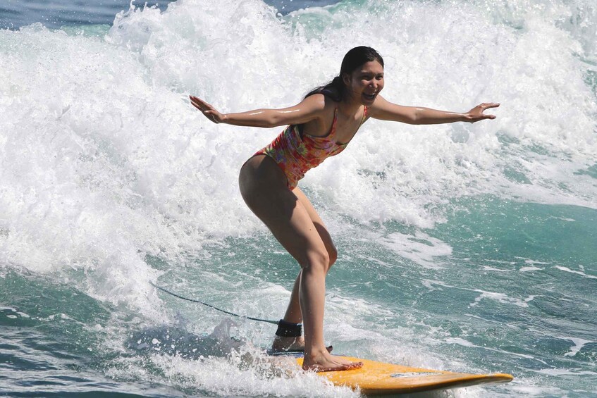 A person surfing on a wave. 1