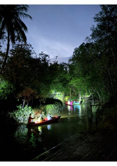 A river with boats and a wooden bridge. 3