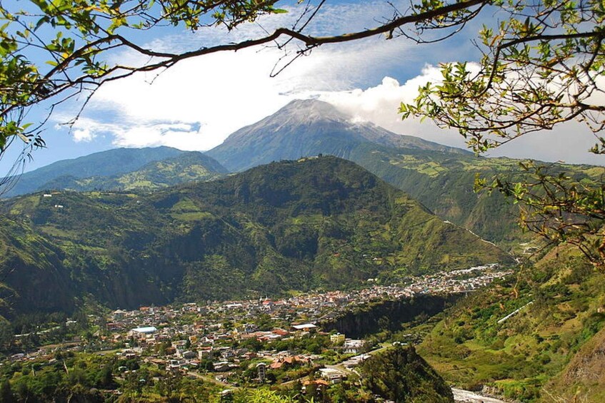 A town nestled in a valley with a mountain in the background. 3