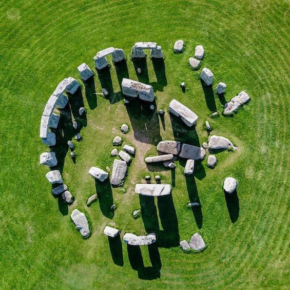 A circular stone arrangement with varying sizes of standing stones. 4
