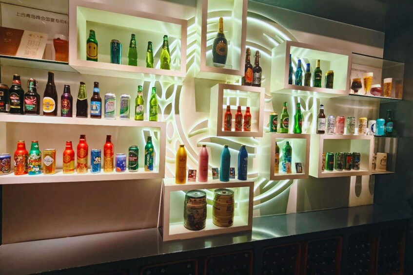 Shelves with various bottles and cans, some with labels and some with text. 2