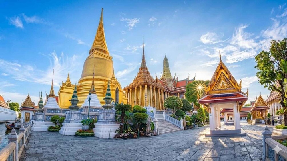 A temple complex with golden spires and traditional architecture. 3