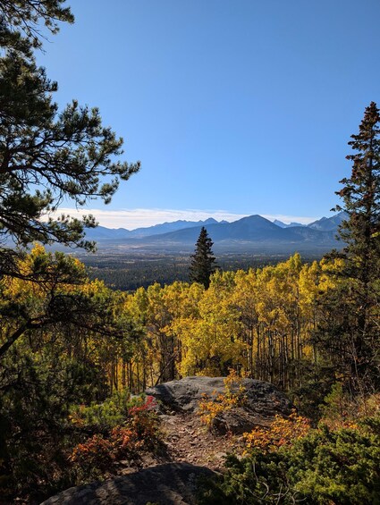 A mountainous landscape with autumn foliage and a clear sky. 3