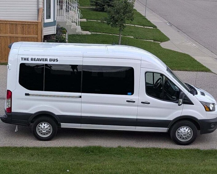 A white van parked on a residential street. 2