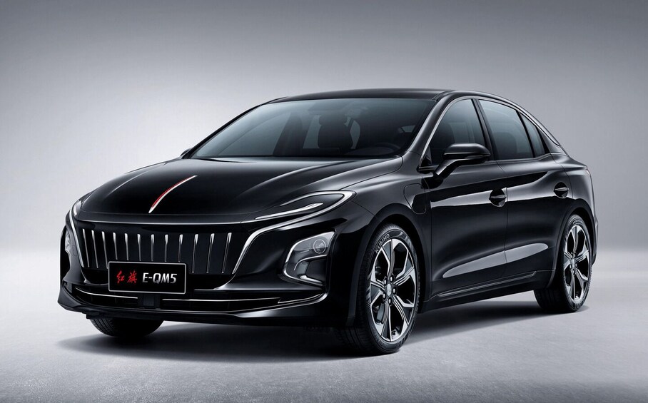 A black sedan with a prominent grille, LED headlights, and alloy wheels. 3