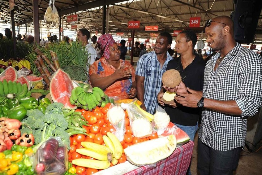 A market with various fruits and vegetables on display. 3