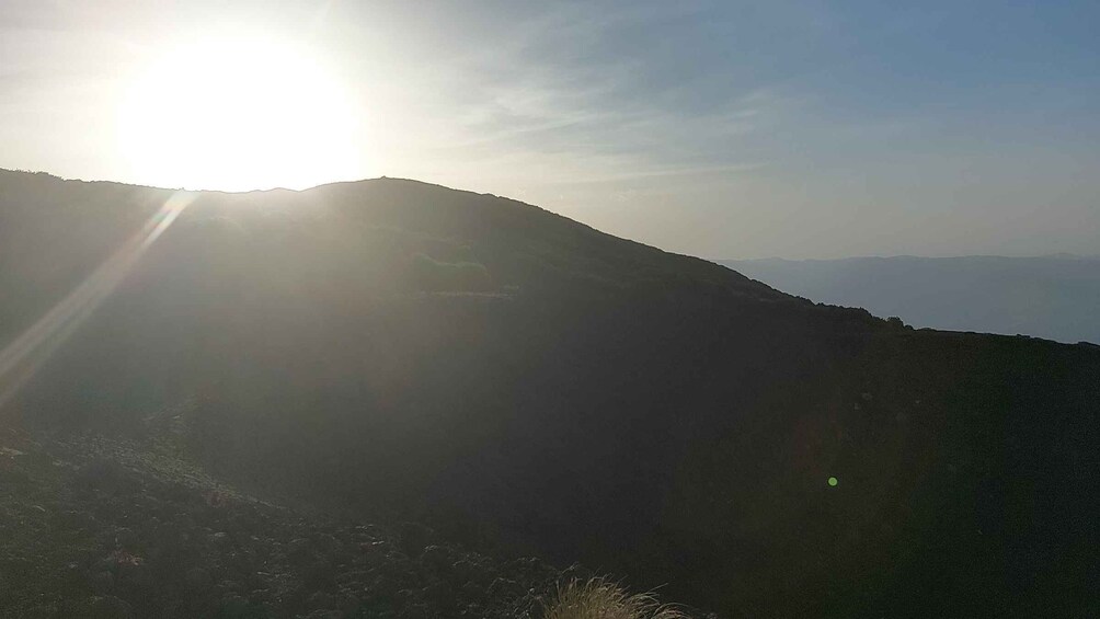 A mountain landscape with the sun shining from the left. 2