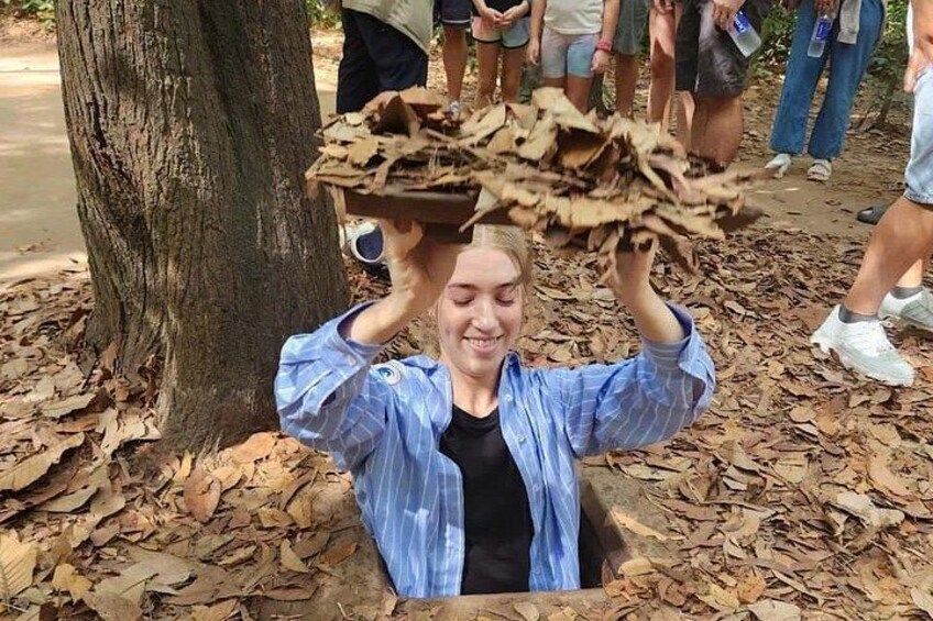 A person holding a large pile of wood chips above their head. 5