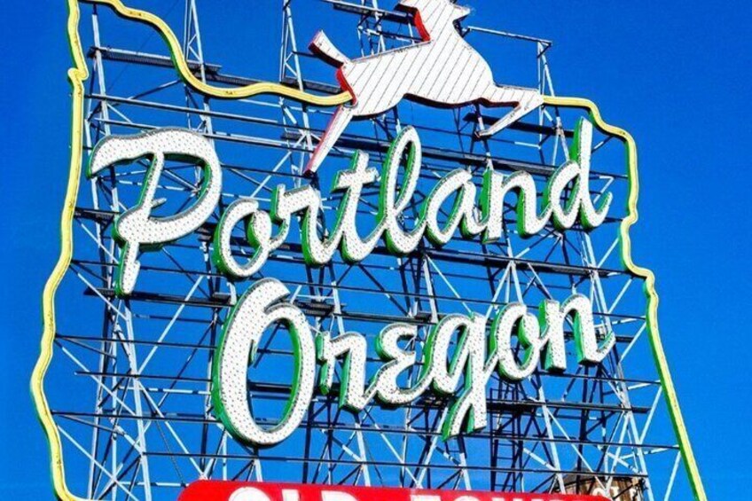 A large sign with 'Portland Oregon' and a horse silhouette. 1