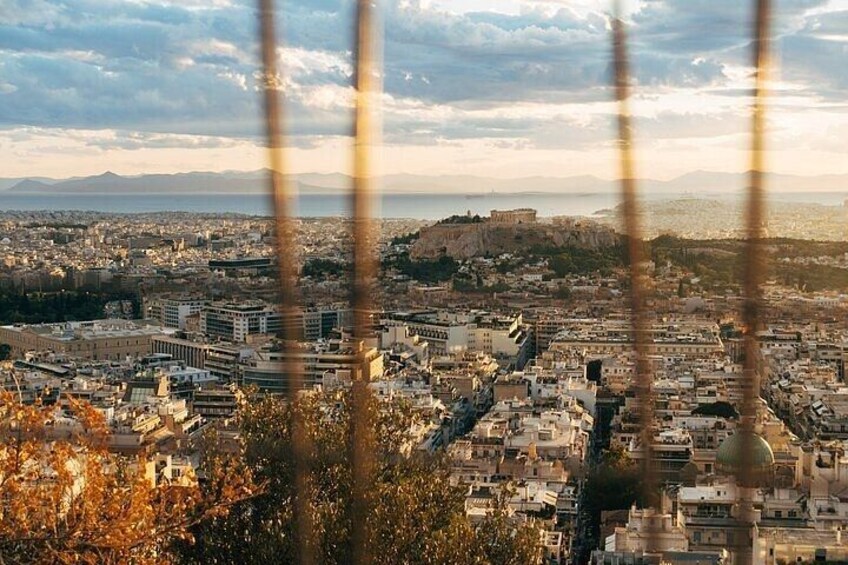 A cityscape with a prominent hill and a dome structure. 2