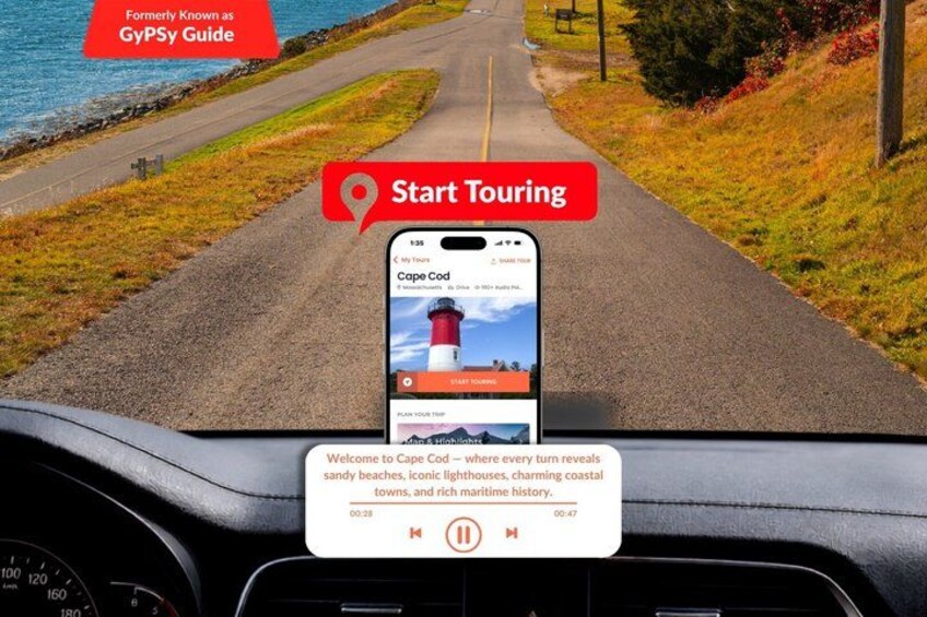 A smartphone displaying a tour app with a coastal road view. 1