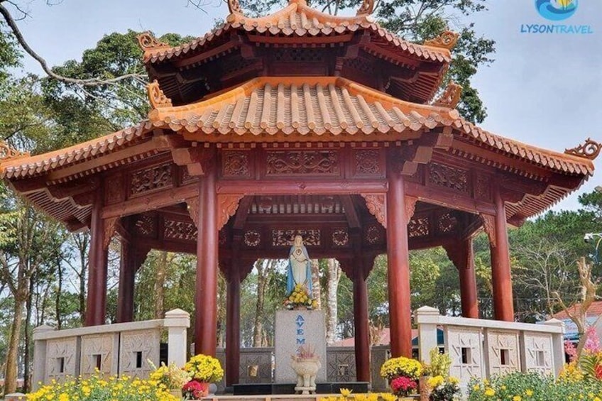 A traditional Chinese pavilion with intricate carvings, surrounded by vibrant flowers and trees. 2