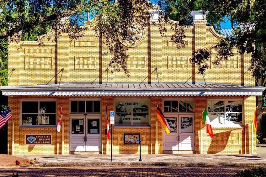 A brick building with a metal roof, a sign reading 'York City State Park,' and two American flags. 5