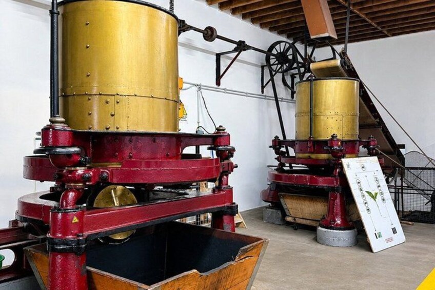 Industrial machinery with large cylindrical components and red structural elements. 3