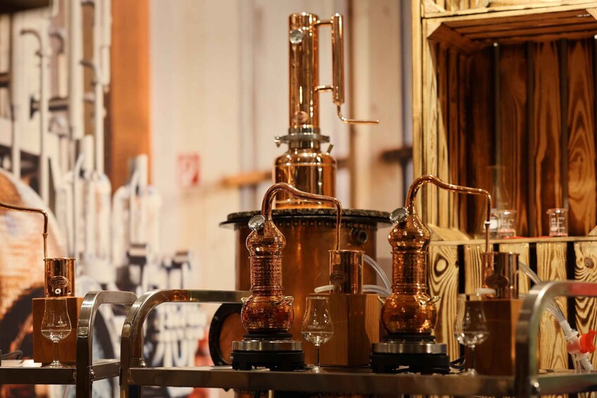 Copper distillation apparatuses in a distillery setting. 4