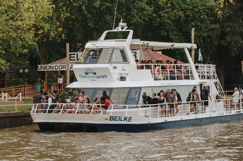 A ferry named 'Beilke' with passengers on board, docked at a pier with a sign reading 'Union Cor.' 5