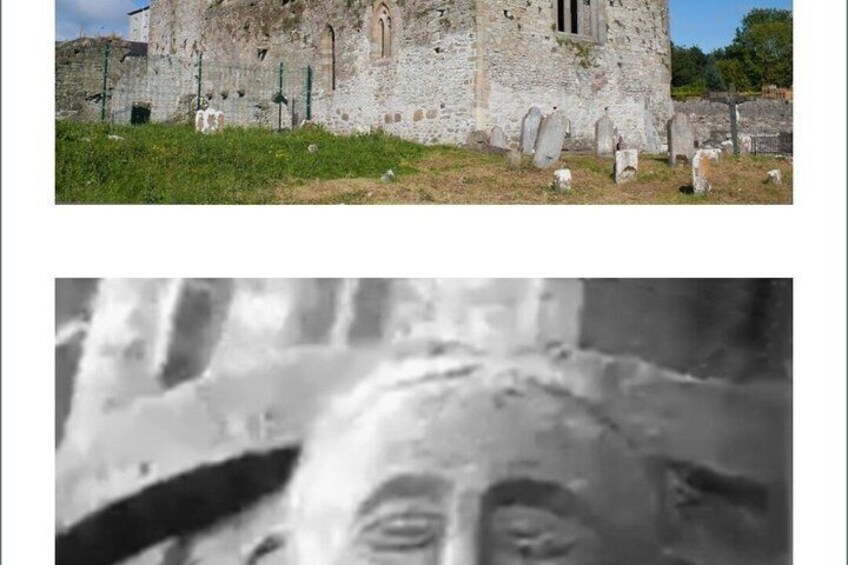 A stone building with a graveyard in front. 3