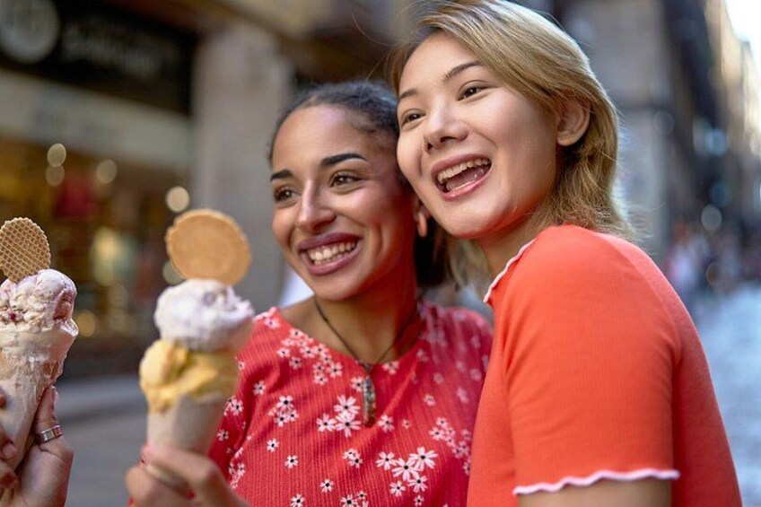 Two people holding ice cream cones. 4