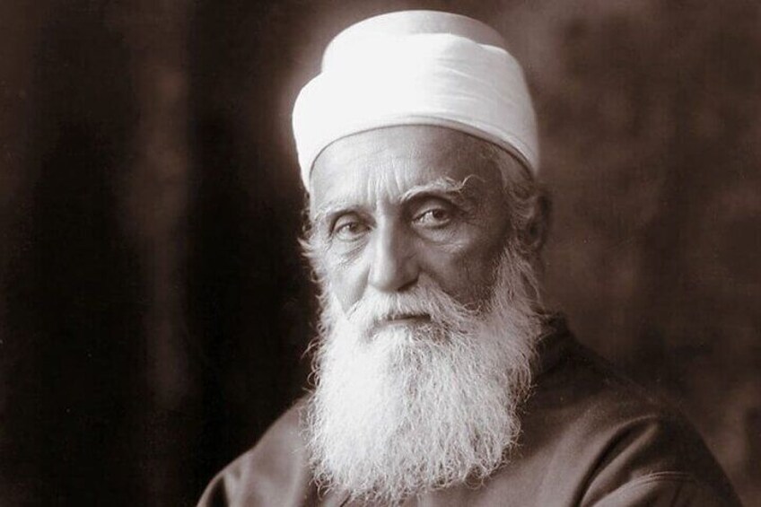 A person with a white beard and a white head covering. 2