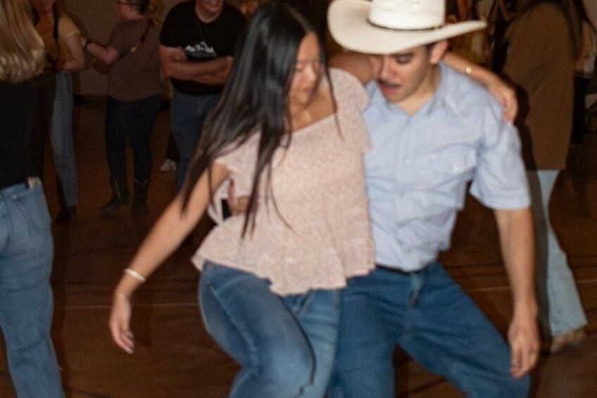 A dance floor with people dancing. 2