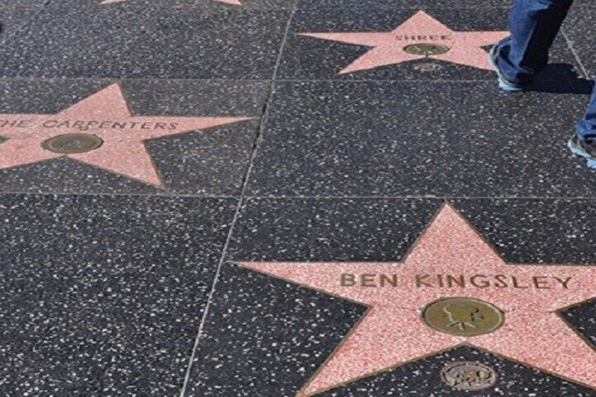 A section of the Hollywood Walk of Fame with stars dedicated to The Carpenters and Ben Kingsley. 2