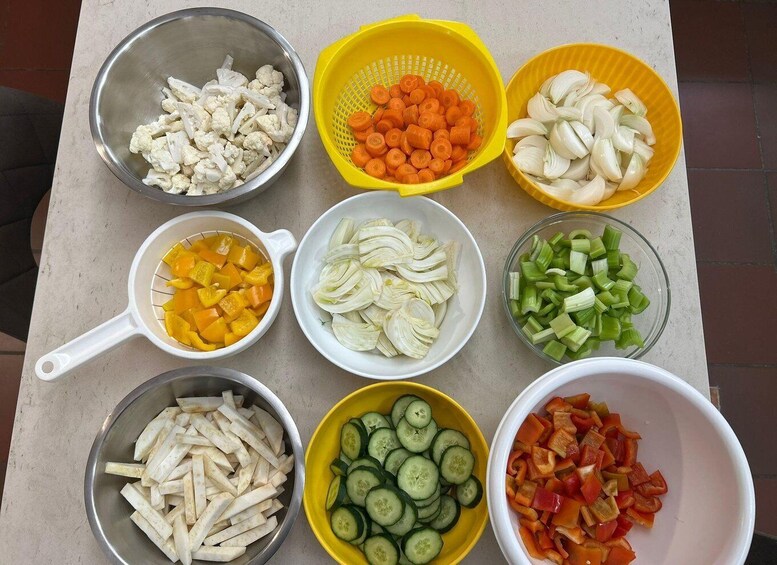 Various vegetables in bowls and colanders. 3