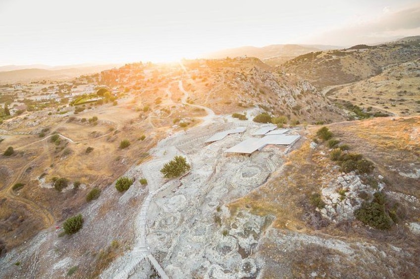 A rugged landscape with a winding path, rocky terrain, and sparse vegetation. 3