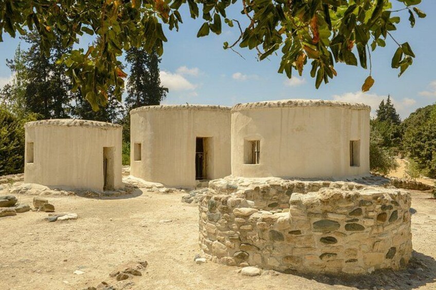 A historical site with ancient stone structures and a clear sky. 2