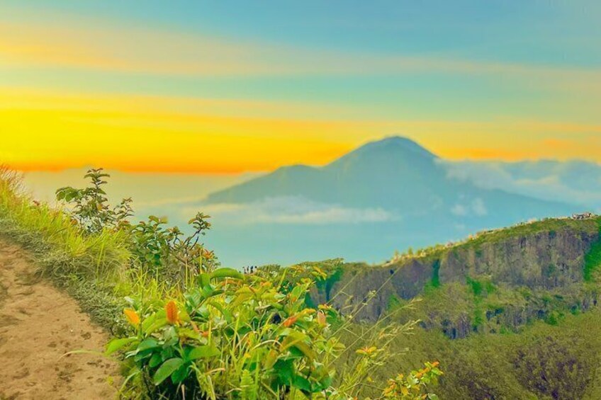 A mountain landscape with a clear sky and a dirt path. 3
