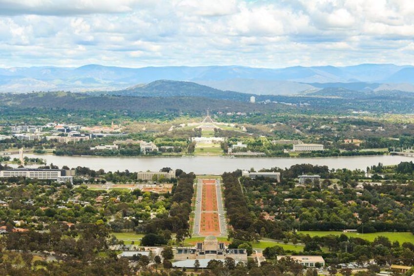A river, a long central pathway, and distant mountains. 3