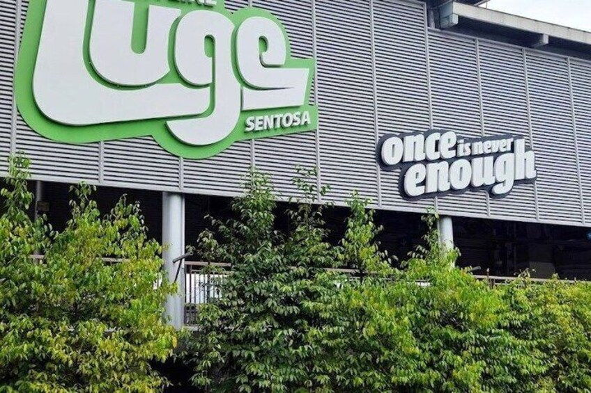 A building with a large green logo and the text 'once is never enough' on the side. 2