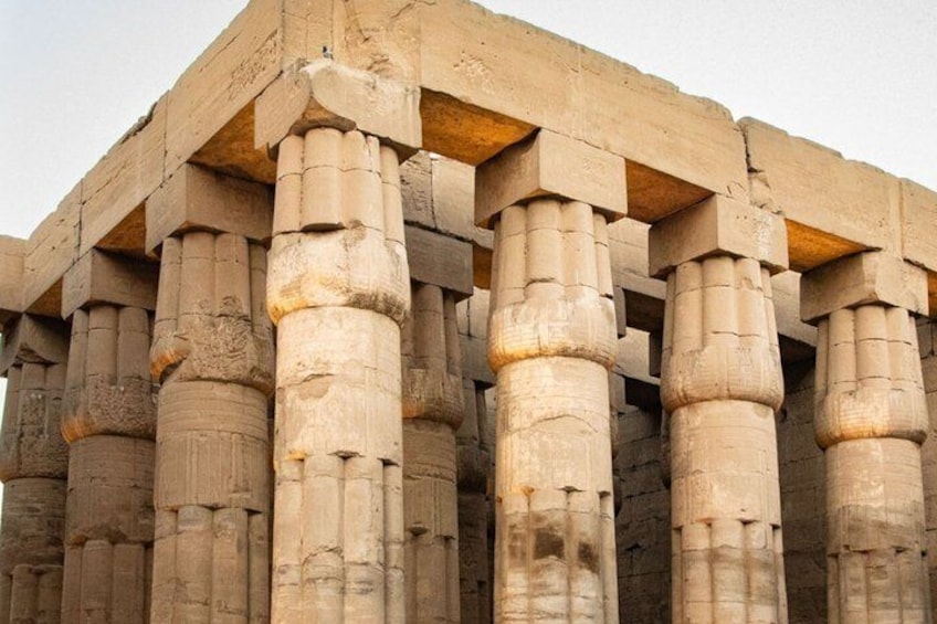 Ancient stone columns with carved capitals. 4