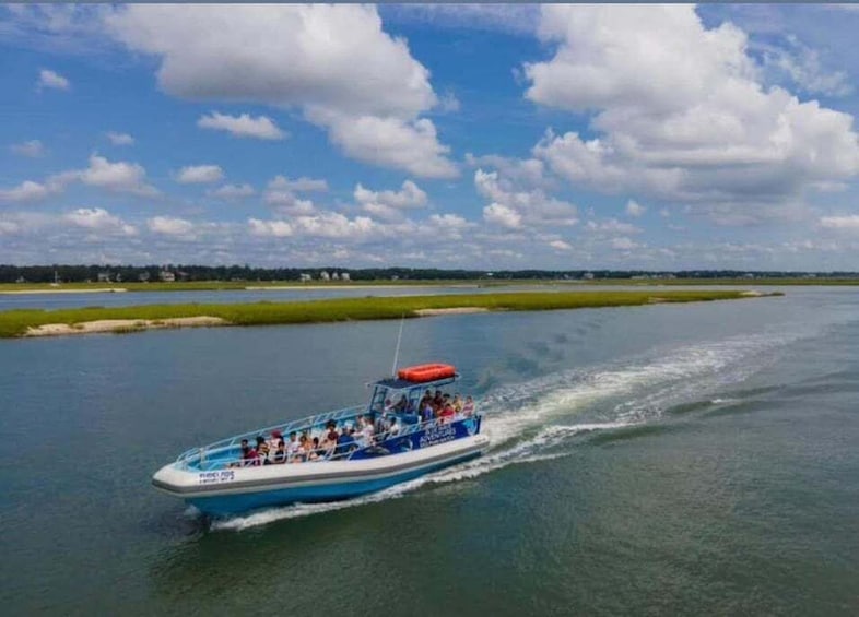 A boat with passengers on a river. 3