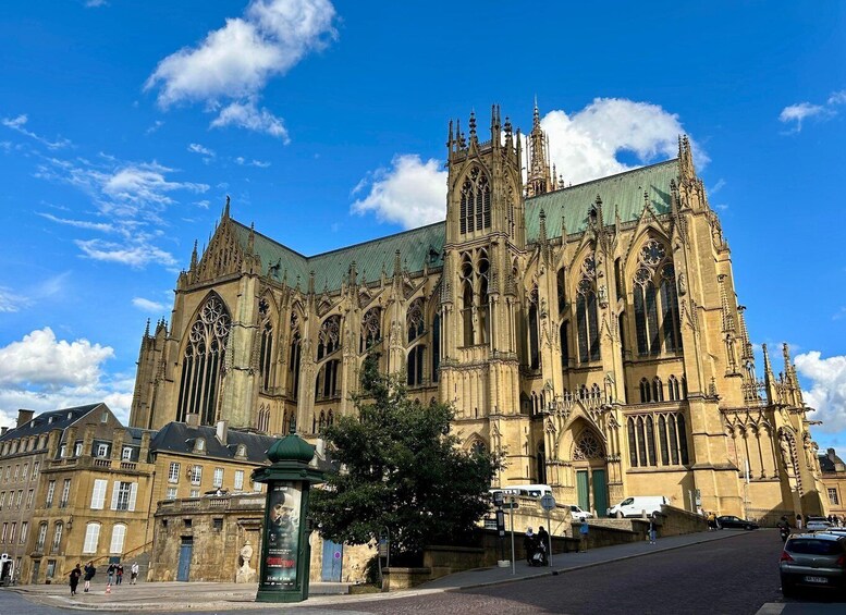 A large Gothic cathedral with intricate architecture and a green roof. 3