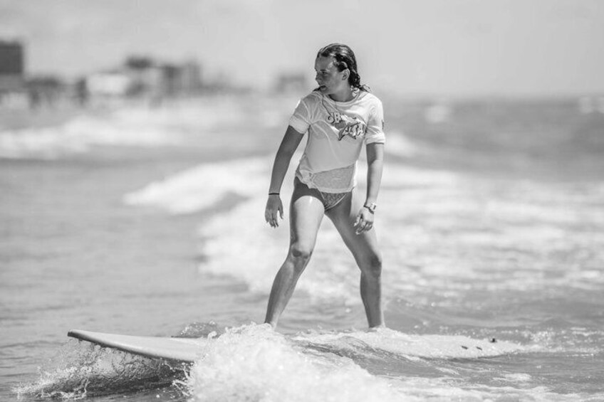 A person surfing on a wave in the ocean. 1