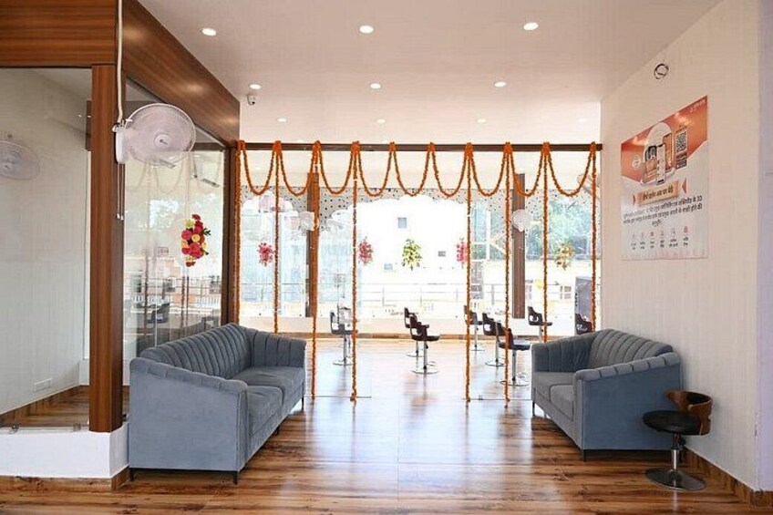 A modern interior with two grey sofas, a wooden floor, and a glass partition. 4