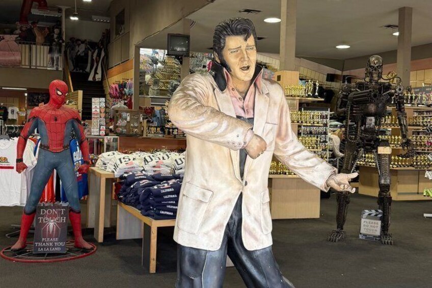 A store with various merchandise, including a Spiderman figure and a robot. 1