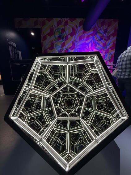 A geometric light installation with a hexagonal pattern. 4
