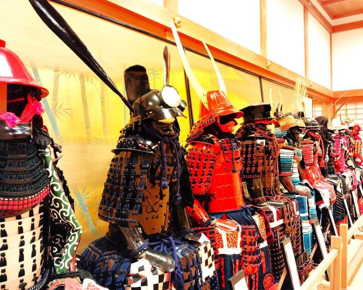 A collection of traditional samurai armor on display. 1