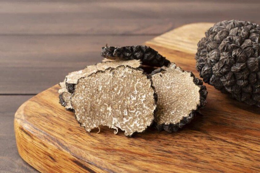 Sliced truffles on a wooden board. 5
