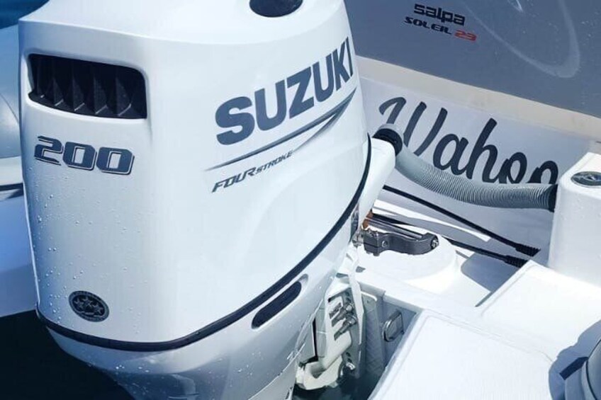 A Suzuki outboard motor with the number 200 and 'Four Stroke' label. 3
