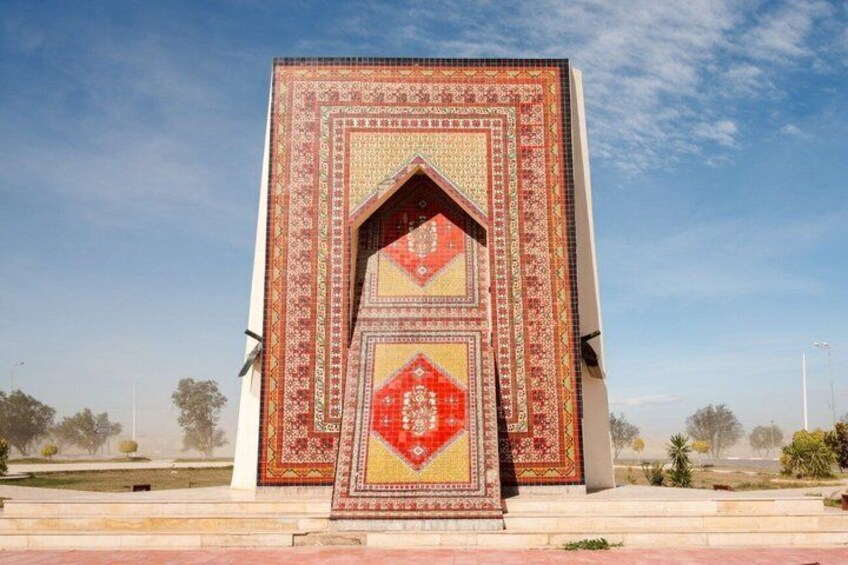 A large, intricately patterned building with a prominent red and yellow design. 3